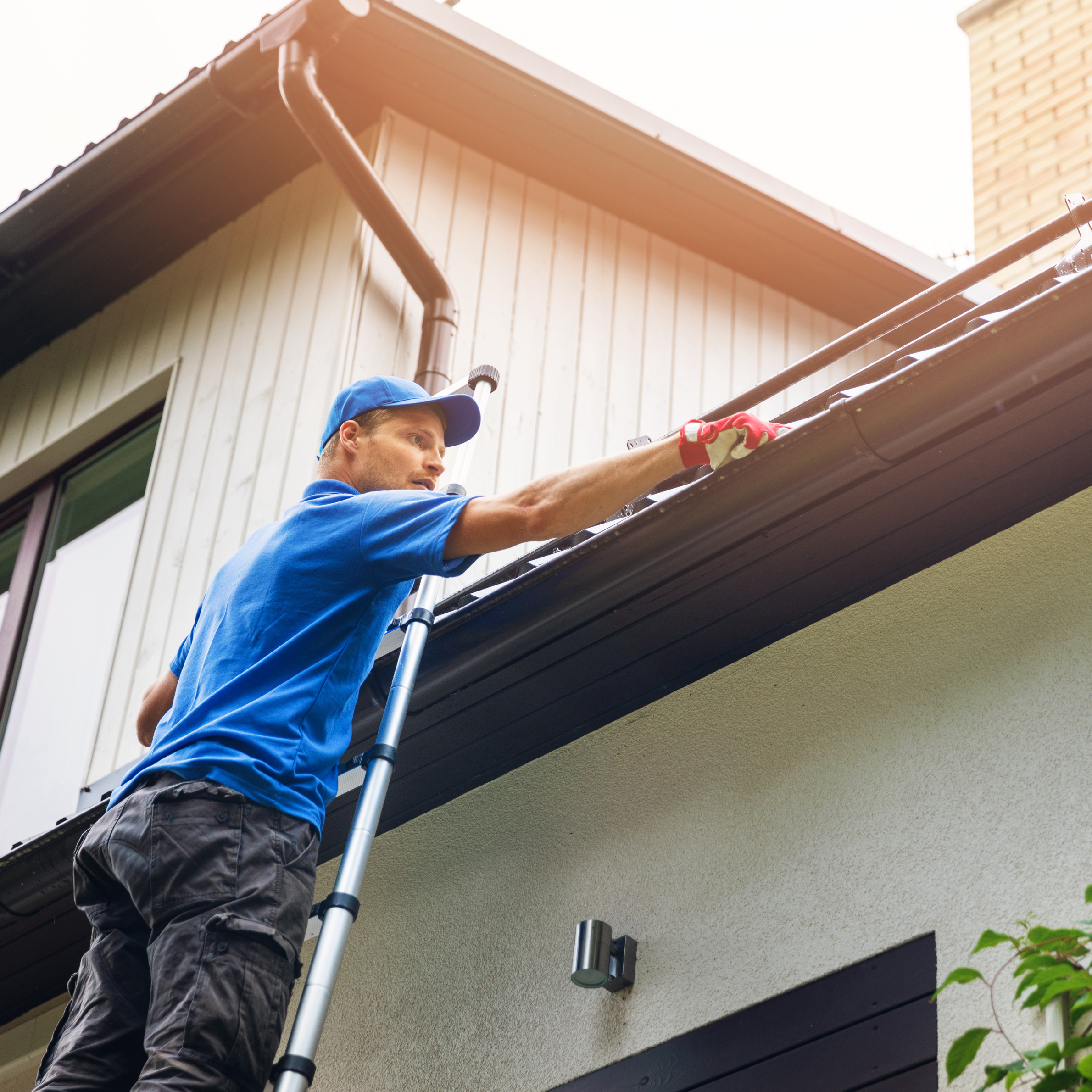 Gutter cleaning on ladder