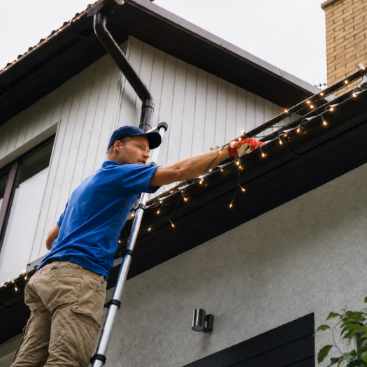 Gutter cleaning on ladder