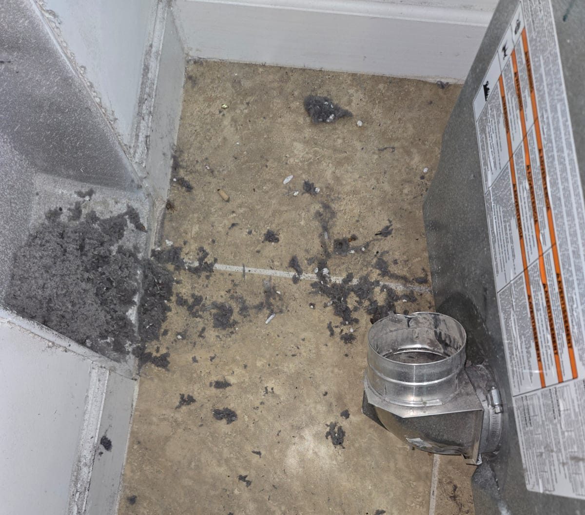 Gutter filled with leaves before professional cleaning