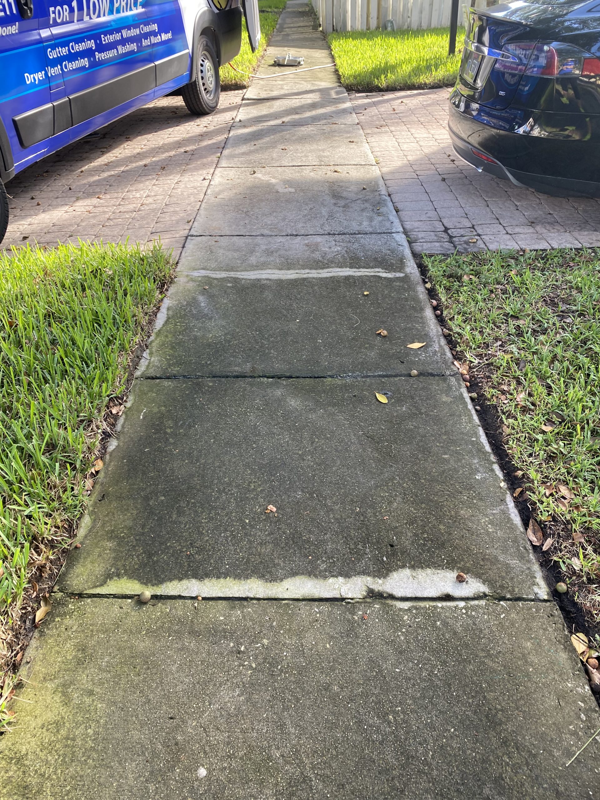 Gutter filled with leaves before professional cleaning