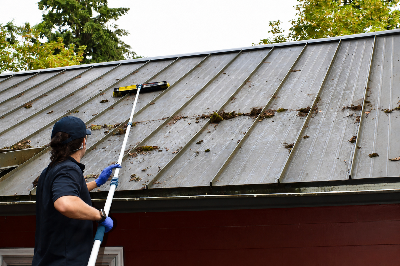 Gutter filled with leaves before professional cleaning